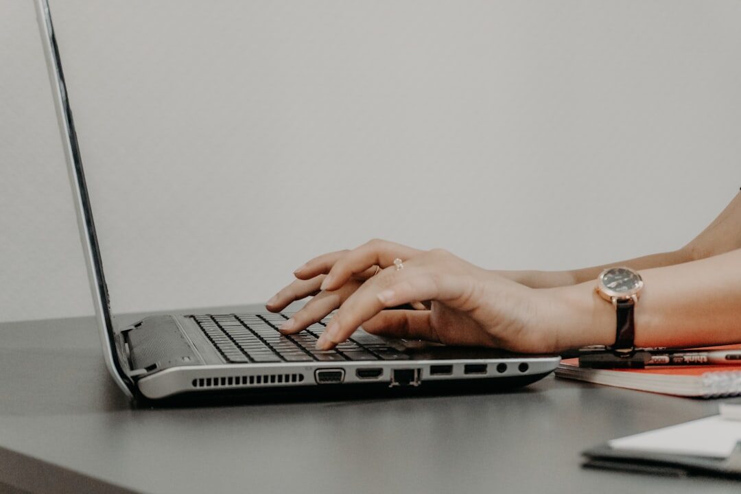 Hands typing on keyboard for email newsletter